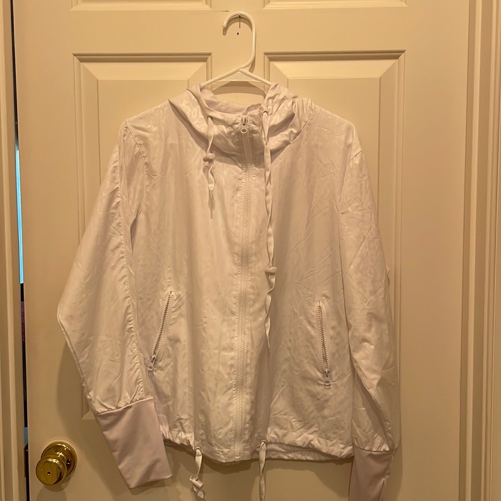 super cute zyia active jacket in white with a hood and thumb holes!